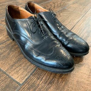 Black Oxfords with Polished Leather Finish and Intricate Perforations